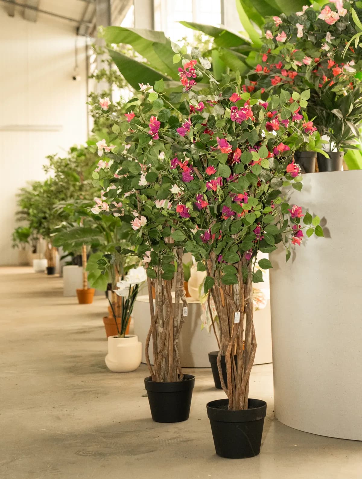 Shelves with artificial plants in the Florafy warehouse